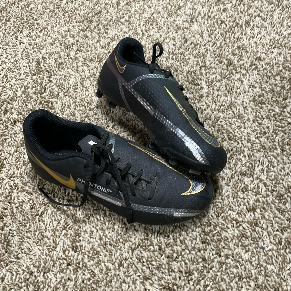 black and gold soccer cleats